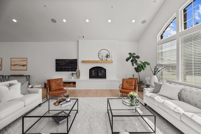 2154 Harvard Way, Redding, CA 96003 - living room featuring wood finished floors, a large fireplace, recessed lighting, and high vaulted ceiling