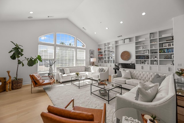 2154 Harvard Way, Redding, CA 96003 - living area with wood finished floors, recessed lighting, built in features, high vaulted ceiling, and baseboards