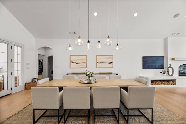 2154 Harvard Way, Redding, CA 96003 - dining space featuring wood finished floors, arched walkways, and lofted ceiling