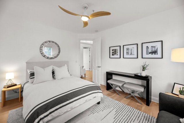 2154 Harvard Way, Redding, CA 96003 - bedroom featuring baseboards, wood finished floors, and a ceiling fan