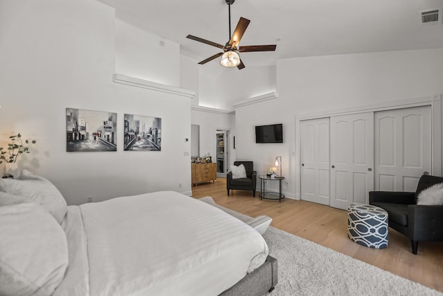 2154 Harvard Way, Redding, CA 96003 - bedroom featuring light wood-style flooring, high vaulted ceiling, a closet, and a ceiling fan