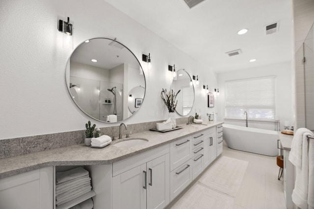 2154 Harvard Way, Redding, CA 96003 - bathroom featuring a stall shower, double vanity, a soaking tub, and recessed lighting