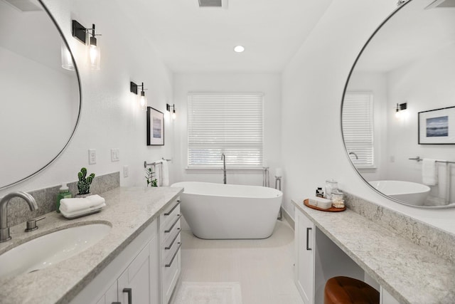 2154 Harvard Way, Redding, CA 96003 - bathroom featuring vanity, a soaking tub, recessed lighting, and baseboards