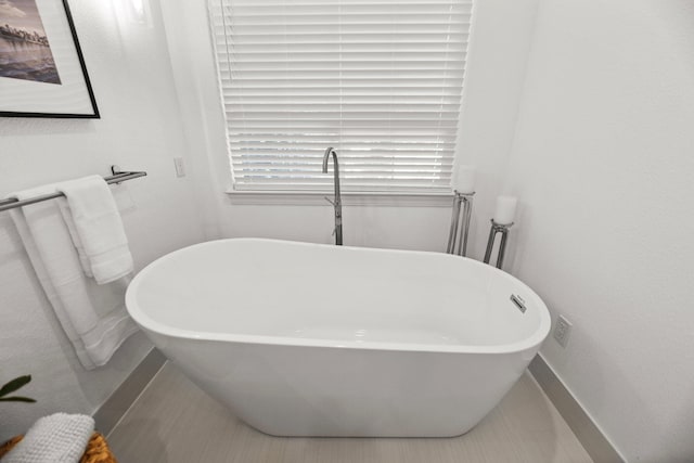 2154 Harvard Way, Redding, CA 96003 - bathroom with baseboards and a freestanding bath