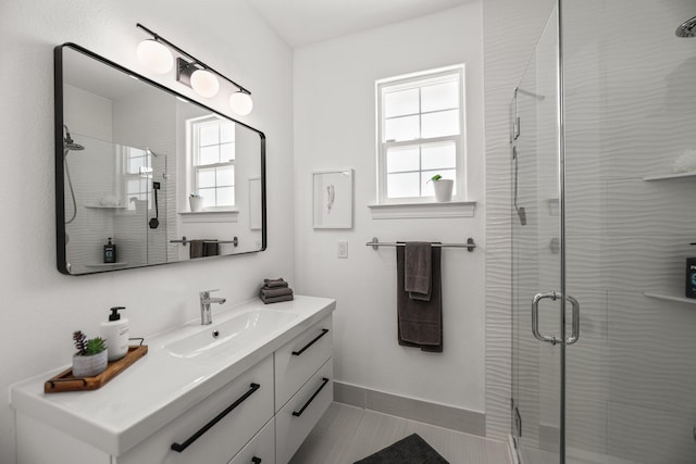 2154 Harvard Way, Redding, CA 96003 - full bathroom featuring healthy amount of natural light, a shower stall, vanity, and baseboards