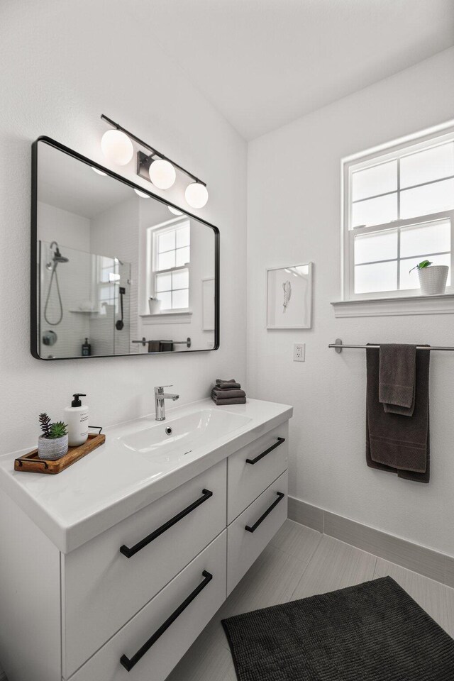 2154 Harvard Way, Redding, CA 96003 - bathroom with walk in shower, vanity, and baseboards