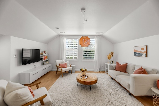 2154 Harvard Way, Redding, CA 96003 - living room featuring light wood-style floors, lofted ceiling, and baseboards