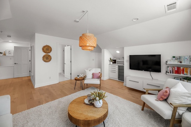 2154 Harvard Way, Redding, CA 96003 - living area featuring light wood-style flooring, recessed lighting, vaulted ceiling, and baseboards