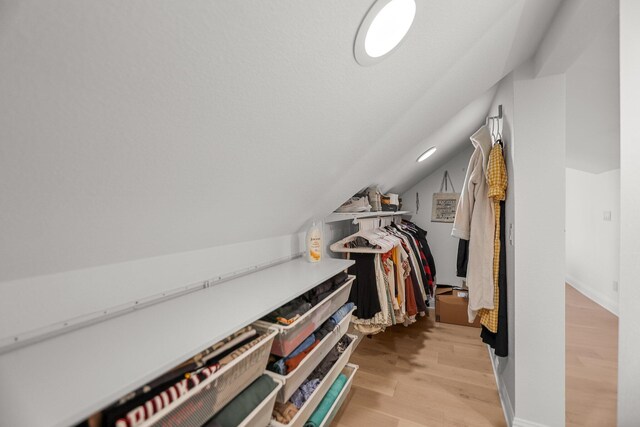 2154 Harvard Way, Redding, CA 96003 - spacious closet featuring light wood-type flooring and lofted ceiling