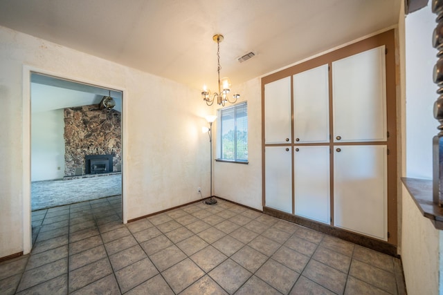2683 Starlight Blvd, Redding, CA 96001 - unfurnished dining area with a chandelier and tile patterned flooring