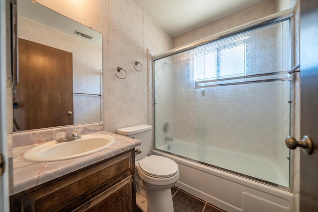 2683 Starlight Blvd, Redding, CA 96001 - bathroom featuring shower / bath combination with glass door, vanity, tile patterned floors, and wallpapered walls