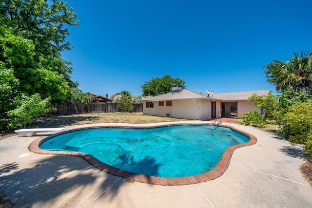 2683 Starlight Blvd, Redding, CA 96001 - view of swimming pool featuring a patio, a fenced backyard, and a diving board