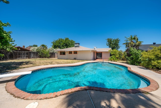 2683 Starlight Blvd, Redding, CA 96001 - view of pool with a fenced backyard, a diving board, and a patio area