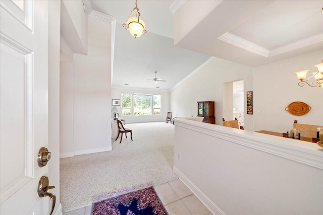 110 Agua Verdi Dr, Red Bluff, CA 96080 - hall with ornamental molding, a chandelier, light carpet, light tile patterned floors, and vaulted ceiling