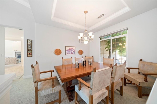 110 Agua Verdi Dr, Red Bluff, CA 96080 - dining room featuring a tray ceiling, a chandelier, light carpet, and crown molding