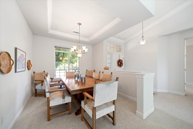 110 Agua Verdi Dr, Red Bluff, CA 96080 - dining area with light colored carpet, a tray ceiling, a chandelier, baseboards, and crown molding