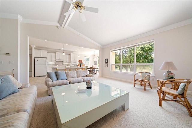 110 Agua Verdi Dr, Red Bluff, CA 96080 - living room featuring light carpet, a ceiling fan, beamed ceiling, baseboards, and high vaulted ceiling