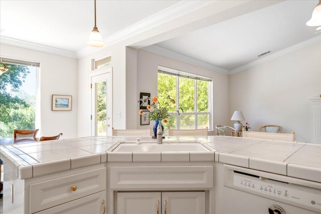 110 Agua Verdi Dr, Red Bluff, CA 96080 - kitchen featuring dishwasher, a sink, white cabinetry, tile countertops, and ornamental molding