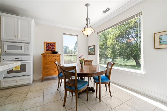 110 Agua Verdi Dr, Red Bluff, CA 96080 - dining space featuring light tile patterned floors, ornamental molding, and baseboards