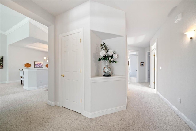 110 Agua Verdi Dr, Red Bluff, CA 96080 - hallway featuring carpet floors, baseboards, and a chandelier