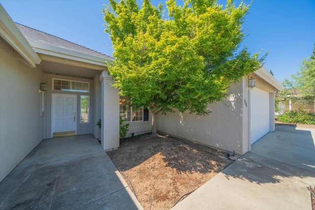 110 Agua Verdi Dr, Red Bluff, CA 96080 - entrance to property featuring an attached garage, stucco siding, and driveway