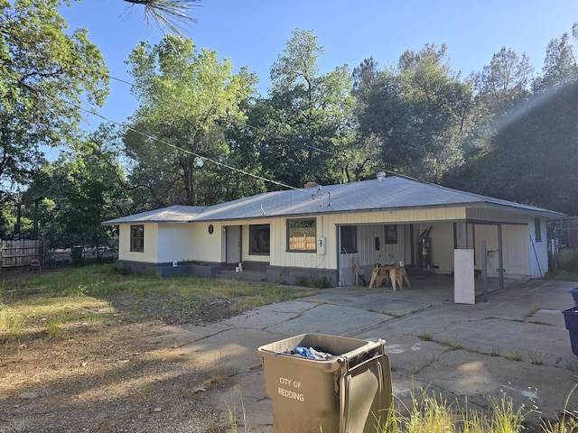 4680 Cedars Rd, Redding, CA 96001 - back of property with driveway, a carport, and fence