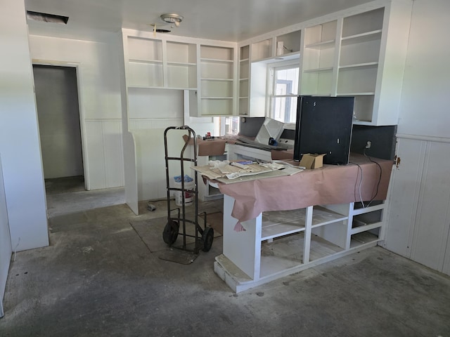 4680 Cedars Rd, Redding, CA 96001 - office area featuring unfinished concrete floors and wainscoting