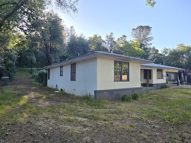 4680 Cedars Rd, Redding, CA 96001 - view of property exterior featuring crawl space and stucco siding