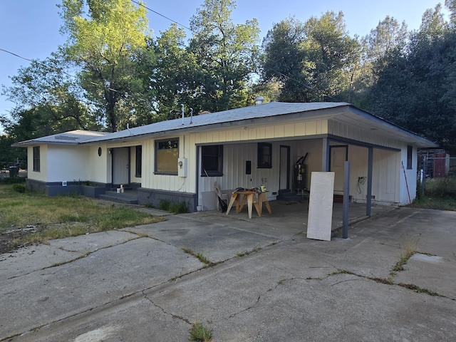 4680 Cedars Rd, Redding, CA 96001 - view of front of property with an attached carport, concrete driveway, and water heater