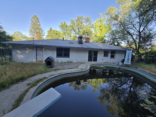 4680 Cedars Rd, Redding, CA 96001 - rear view of property featuring a chimney and an outdoor pool