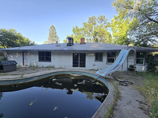 4680 Cedars Rd, Redding, CA 96001 - back of property with a chimney and an outdoor pool