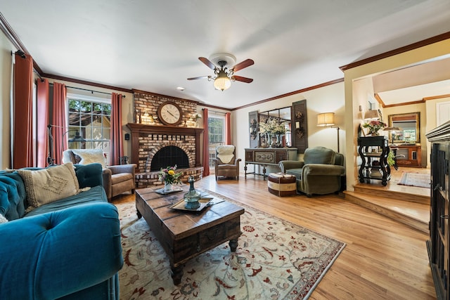 2990 Forest Hills Dr, Redding, CA 96002 - living room with a fireplace, crown molding, a ceiling fan, and light wood-style flooring