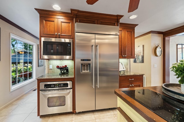 2990 Forest Hills Dr, Redding, CA 96002 - kitchen featuring built in appliances, a ceiling fan, decorative backsplash, ornamental molding, and light tile patterned flooring