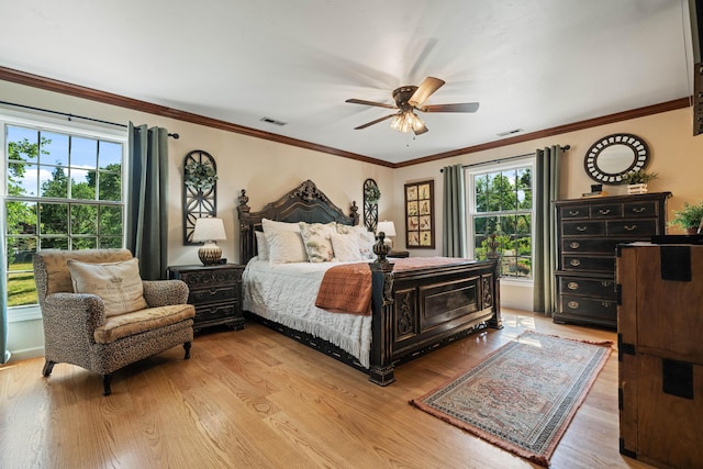 2990 Forest Hills Dr, Redding, CA 96002 - bedroom featuring light wood-style floors, a ceiling fan, and ornamental molding