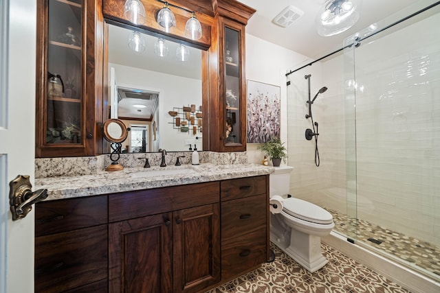 2990 Forest Hills Dr, Redding, CA 96002 - bathroom featuring a stall shower, toilet, vanity, and tile patterned floors