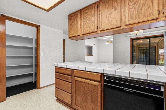 1152 Edgewood Dr, Redding, CA 96003 - kitchen featuring tile counters, a ceiling fan, and brown cabinets