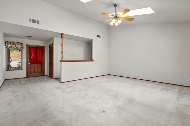 1152 Edgewood Dr, Redding, CA 96003 - unfurnished room with a skylight, carpet flooring, baseboards, ceiling fan, and vaulted ceiling