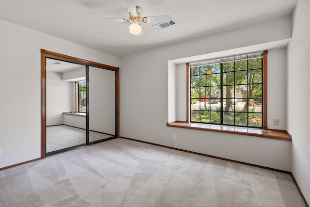 1152 Edgewood Dr, Redding, CA 96003 - unfurnished bedroom with carpet, a closet, baseboards, and ceiling fan