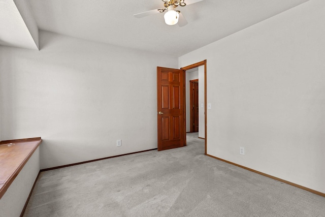 1152 Edgewood Dr, Redding, CA 96003 - spare room featuring light colored carpet, ceiling fan, and baseboards