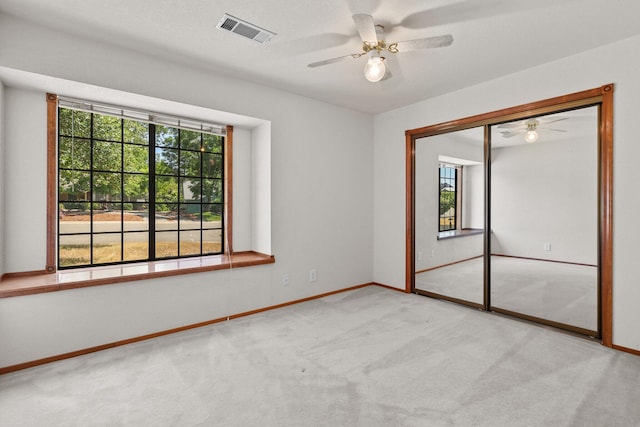 1152 Edgewood Dr, Redding, CA 96003 - empty room with ceiling fan, plenty of natural light, and carpet