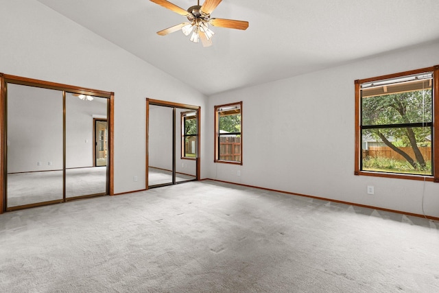 1152 Edgewood Dr, Redding, CA 96003 - unfurnished bedroom with multiple closets, carpet, lofted ceiling, and baseboards