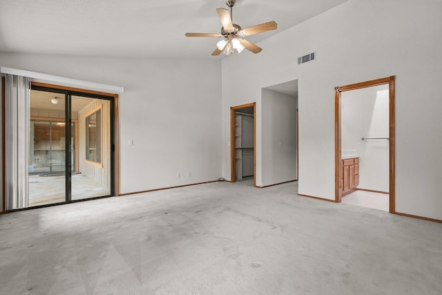 1152 Edgewood Dr, Redding, CA 96003 - unfurnished bedroom featuring lofted ceiling, access to exterior, light colored carpet, baseboards, and ensuite bathroom