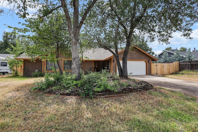 1152 Edgewood Dr, Redding, CA 96003 - ranch-style home featuring fence, driveway, and a garage
