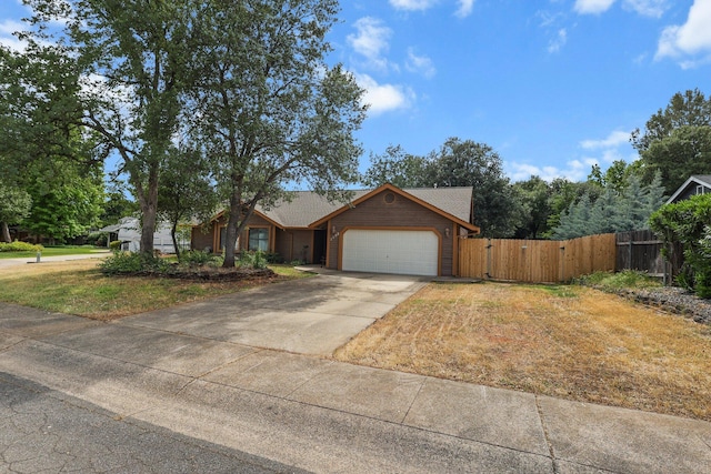1152 Edgewood Dr, Redding, CA 96003 - single story home with an attached garage, driveway, and a gate