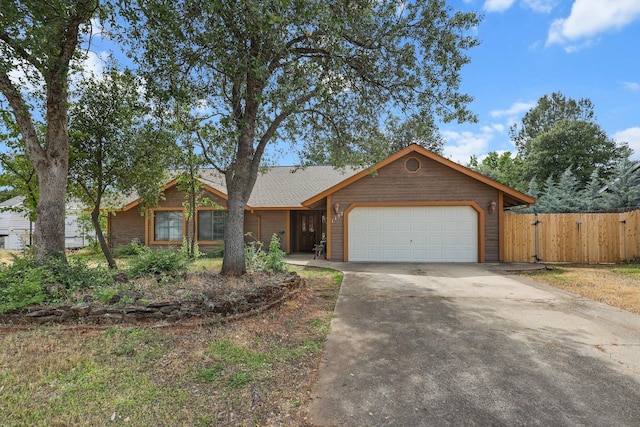 1152 Edgewood Dr, Redding, CA 96003 - view of front facade with an attached garage, driveway, fence, and a gate