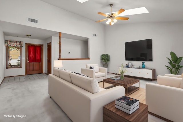 1152 Edgewood Dr, Redding, CA 96003 - living room featuring lofted ceiling, a skylight, and a ceiling fan