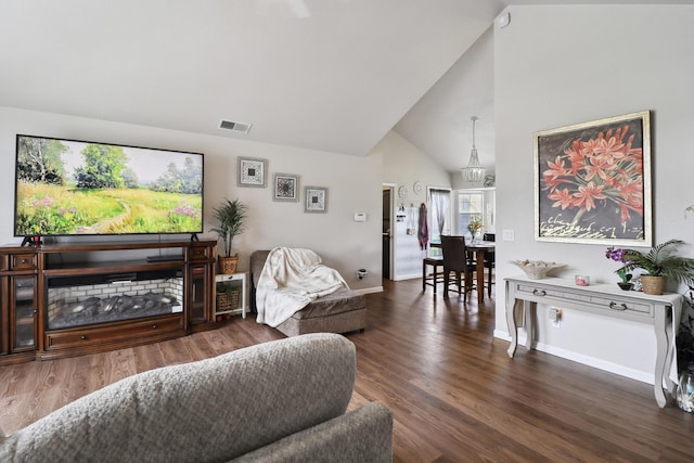 2773 Crystal Tree Dr, Redding, CA 96001 - living area featuring high vaulted ceiling, wood finished floors, and baseboards
