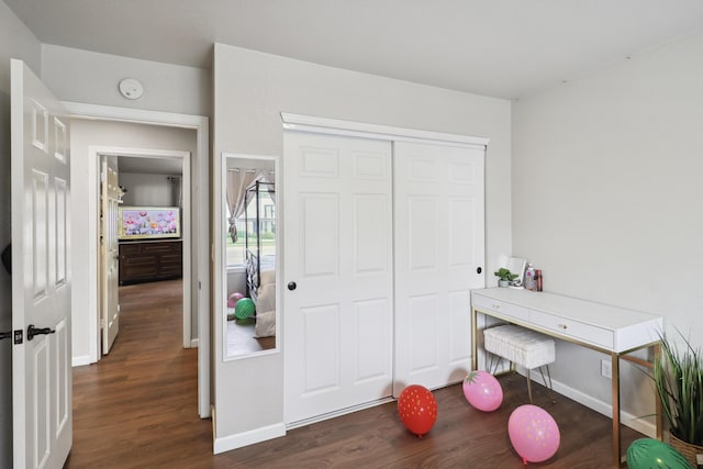 2773 Crystal Tree Dr, Redding, CA 96001 - bedroom with dark wood-style floors, baseboards, and a closet