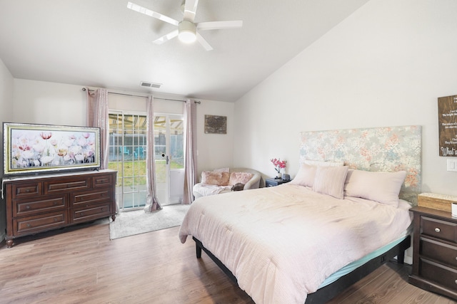 2773 Crystal Tree Dr, Redding, CA 96001 - bedroom with vaulted ceiling, access to exterior, wood finished floors, and ceiling fan