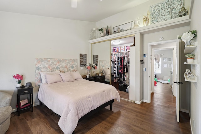 2773 Crystal Tree Dr, Redding, CA 96001 - bedroom with a closet, dark wood-style floors, and baseboards